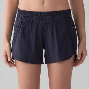 Lululemon Tracker Mid-Rise Lined Short 4". Dark purple/plum colored